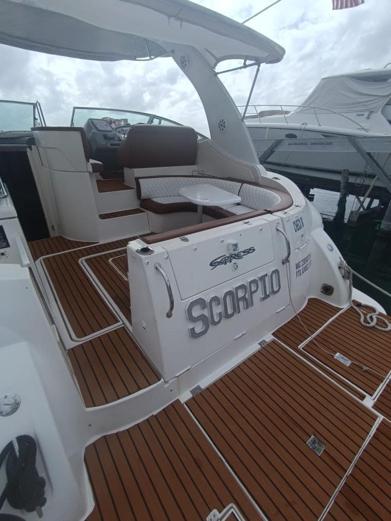 The stern with the name SCORPIO and the teak swimming platform.