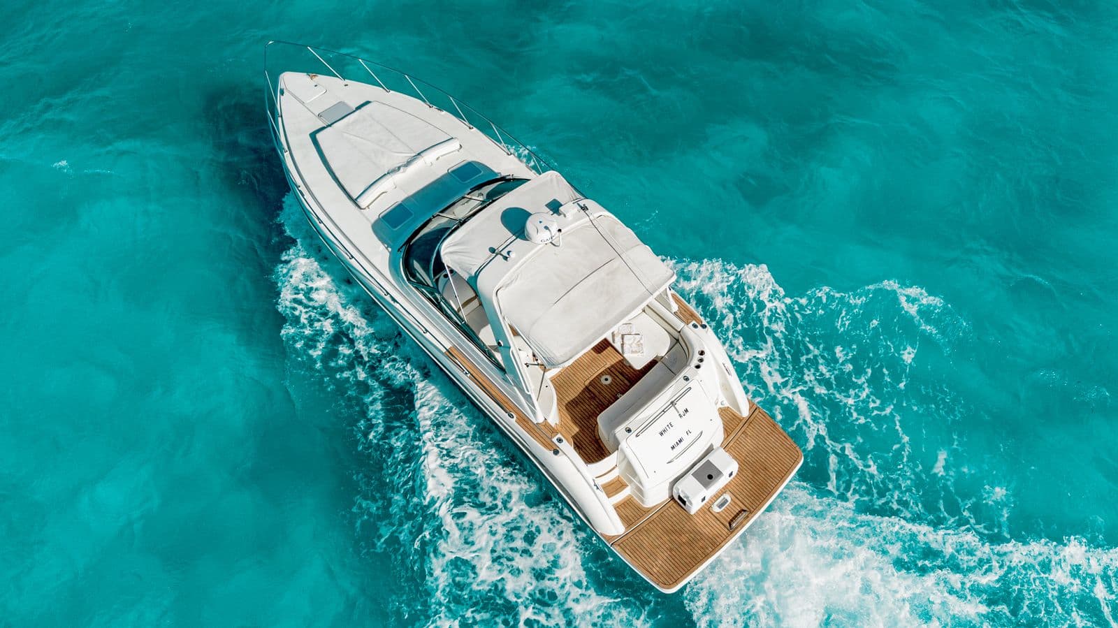 The yacht underway seen from the air, with the cockpit in view.