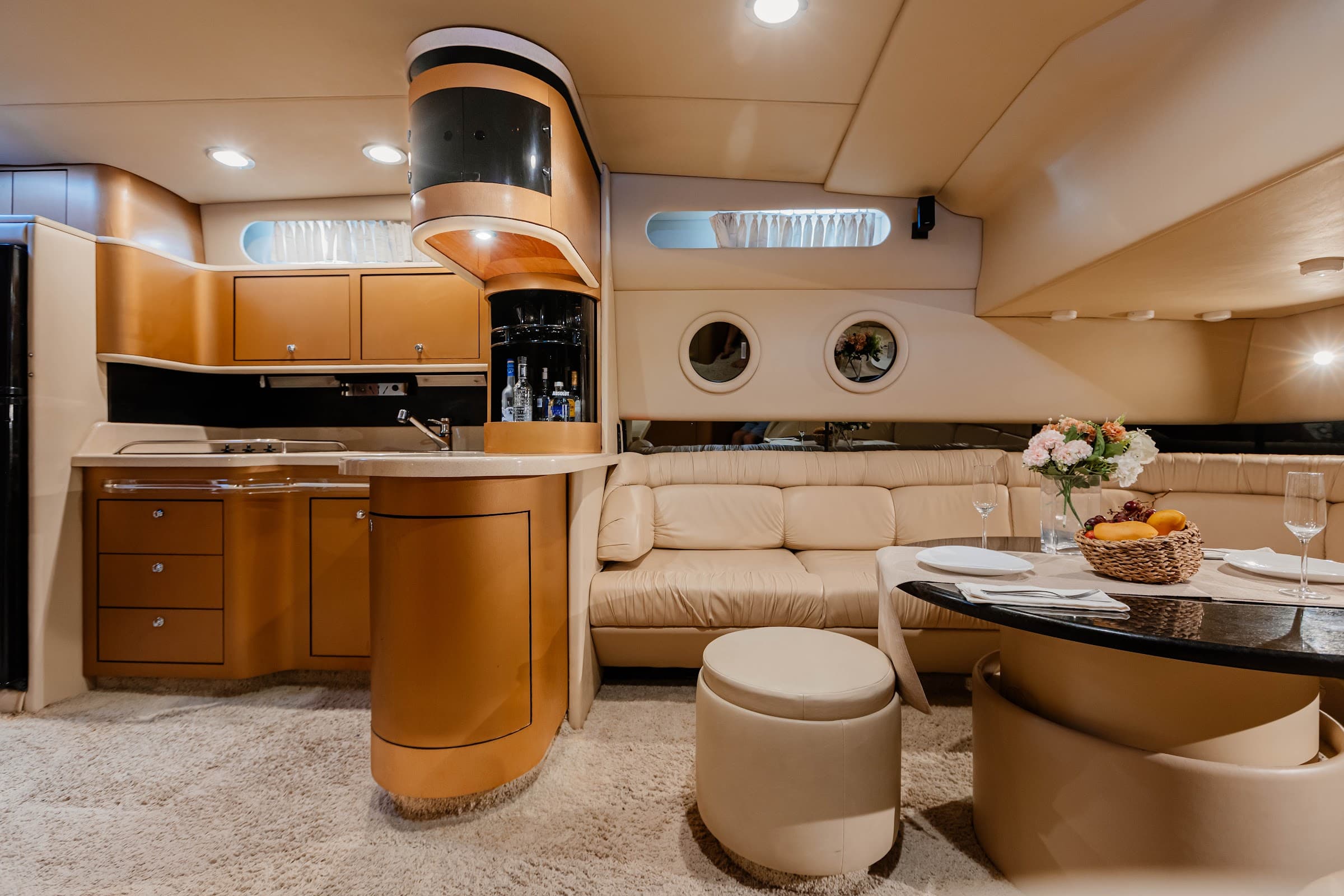 Interior lounge with sofa, table, and bar furniture.