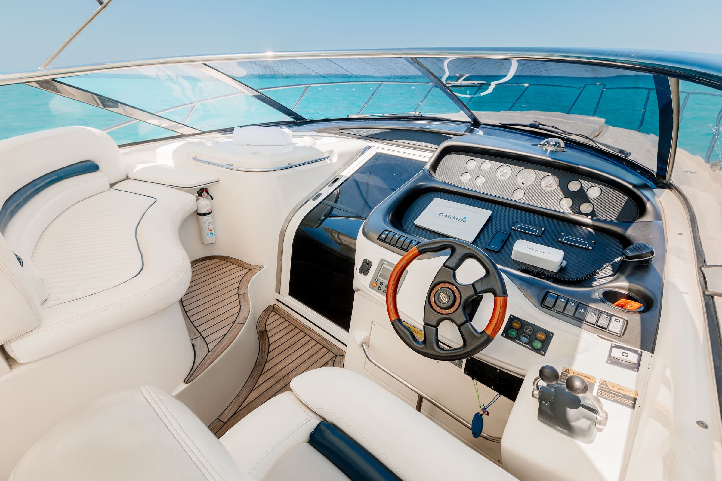 Command post with steering wheel, instruments, and captain's seat.