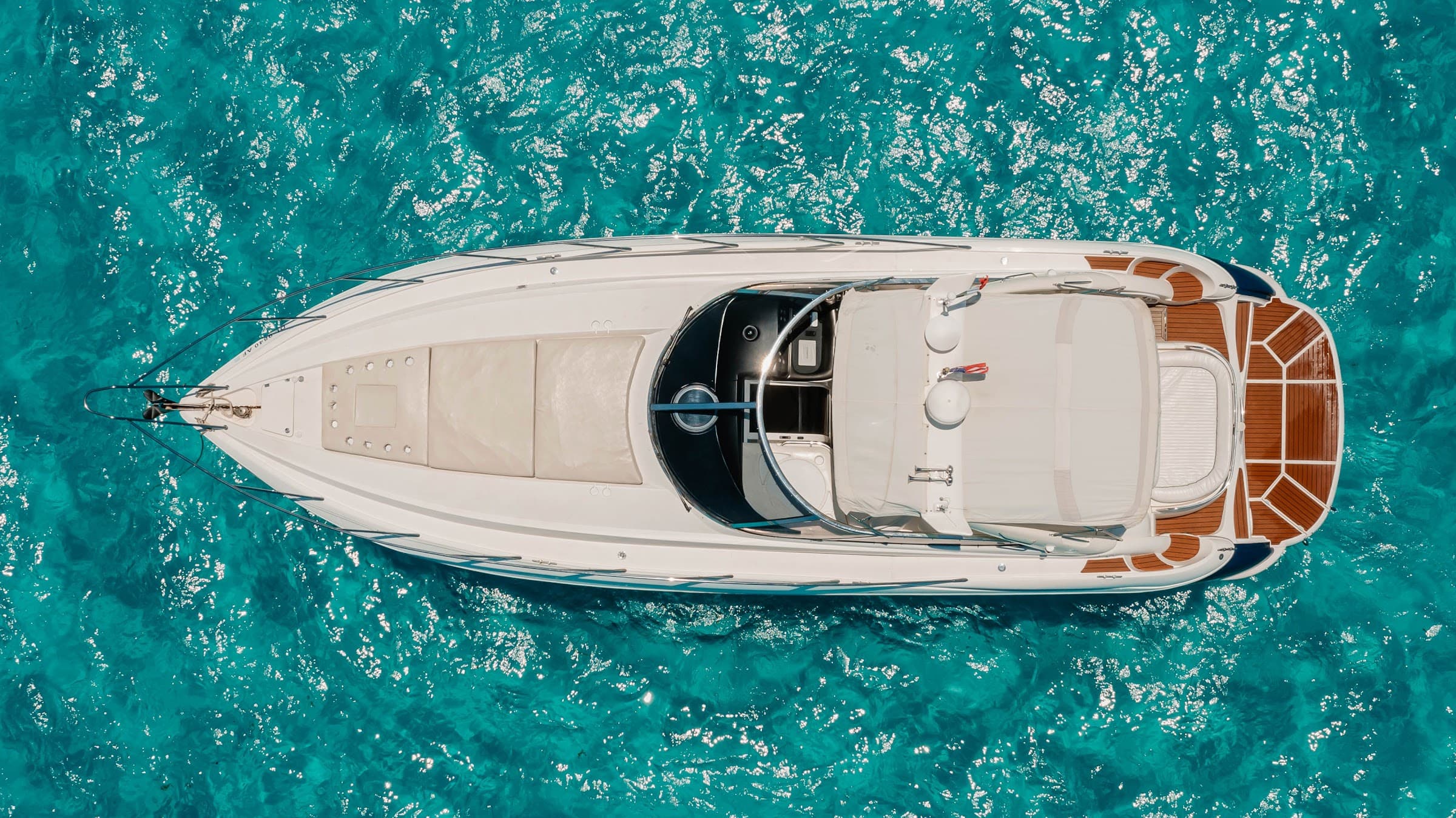 The yacht photographed from above, with the bow deck in view.